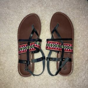 black leather sandals with colorful design strap